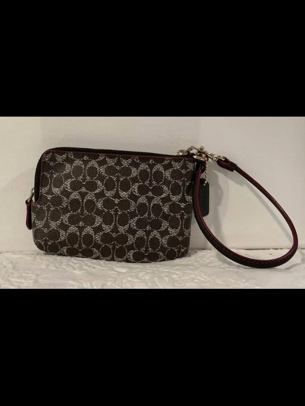 Brown and Black Coach wristlet